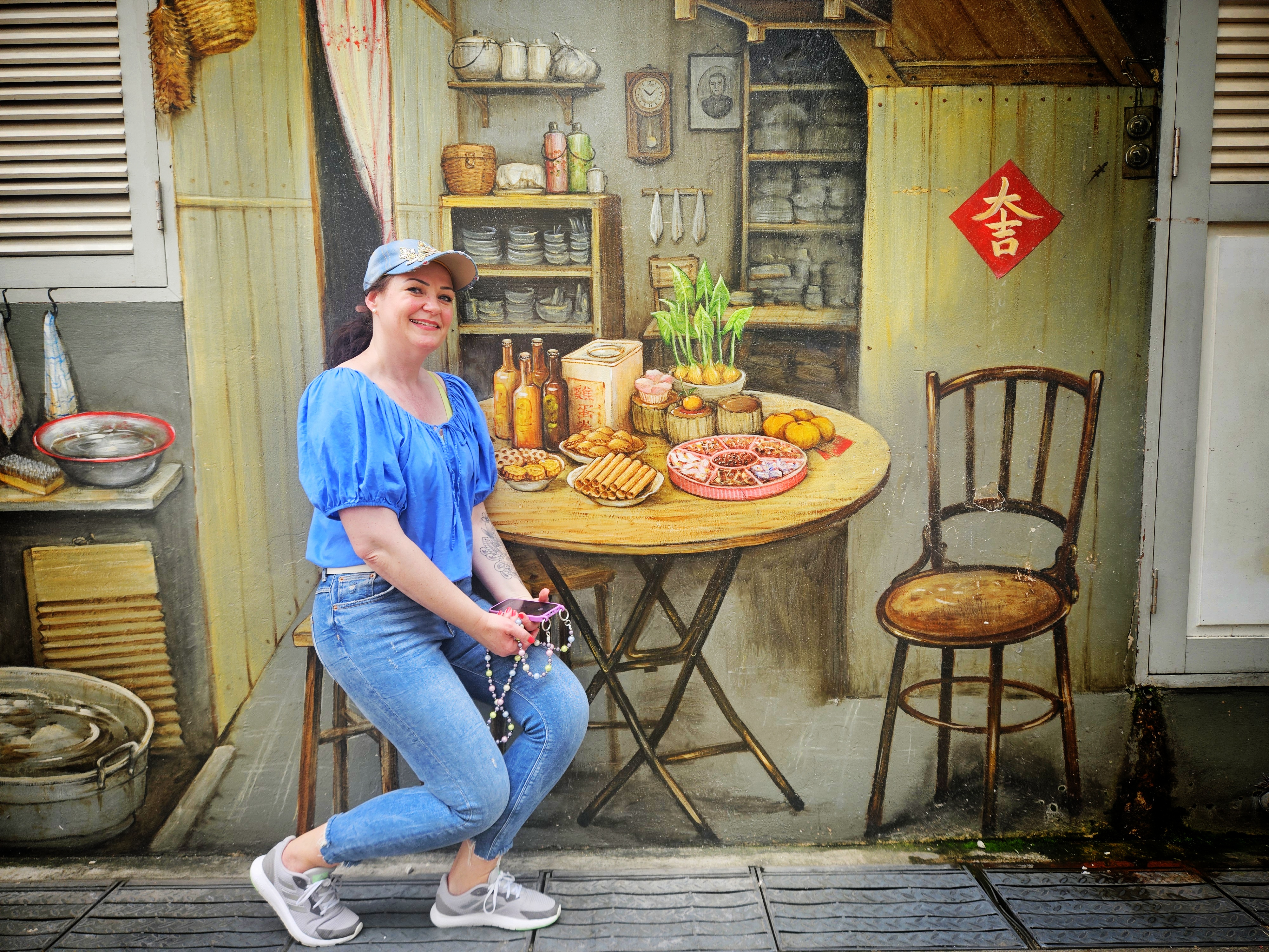 Traveller enjoying a heritage street art experience in Singapore with a local guide