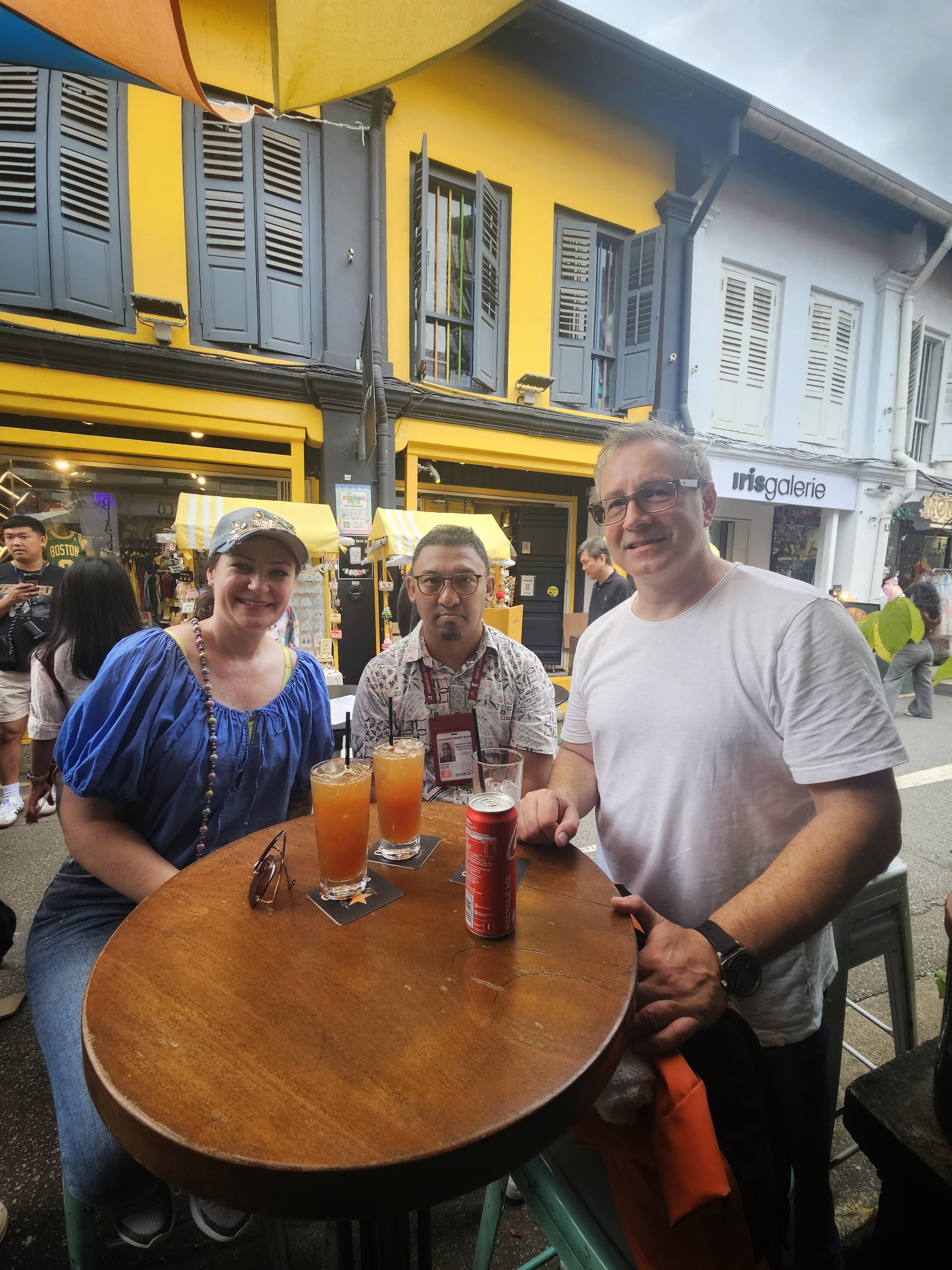 Relaxing with guests along Haji Lane in Kampong Gelam, enjoying drinks and conversation